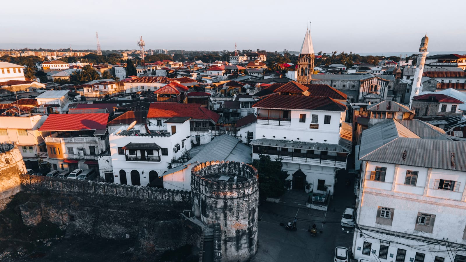 Stone Town rooftops and the Old Fort tower at dusk