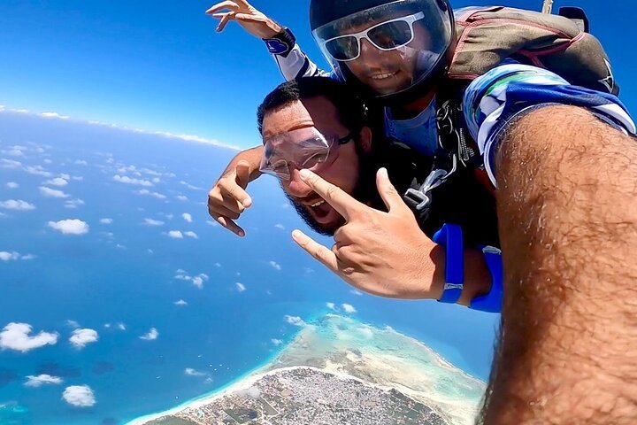 Tandem skydiver in freefall high above the Zanzibar coastline