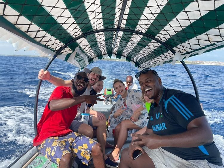 Happy guests laughing together on a boat trip
